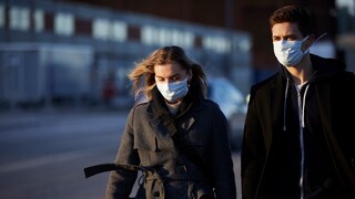 Face Masks: A couple on the street wears face masks