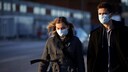 Face Masks: A couple on the street wears face masks