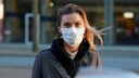 Face Mask: Young Woman Wearing a Mouth and Nose Covering
