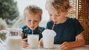 Children Drink Milk With a Straw