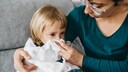 Mother Cleans Little Girl's Nose