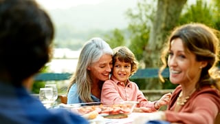 Multiple generations sit happily at the dining table
