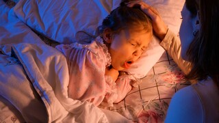 Croup: Child Lies in Bed and Coughs