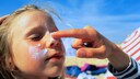 Girl Gets Sunscreen Applied to Her Face