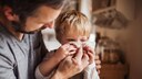 Infections in Children: Father Helps Son Blow His Nose