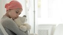 Leukemia Most Common Cancer in Children: Girl With Headscarf and Teddy Bear in Hospital Bed
