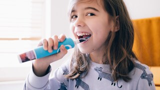 Child with Electric Toothbrush