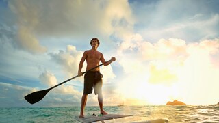 Stand-Up Paddleboarding Tips: Man Surfs on a SUP