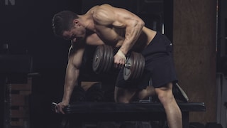 Time Under Tension (TUT): Muscular Man Performing Dumbbell Rows