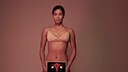 Woman holding a picture of the female sexual organ.