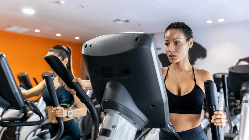 Woman on a cross trainer