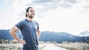 Man stands laughing, possibly with a strong immune system