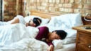 Couple catching up on sleep at the weekend