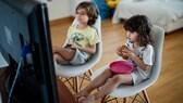 Children eat in front of the TV