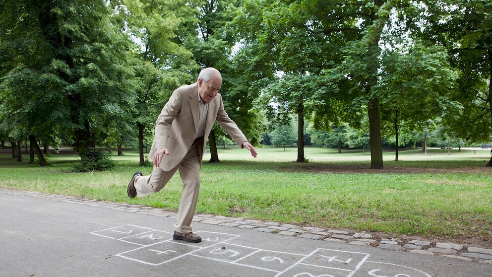 A man stands on one leg