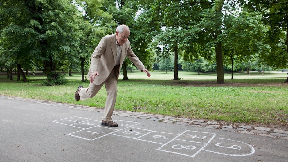 A man stands on one leg