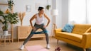 A woman does a workout at home
