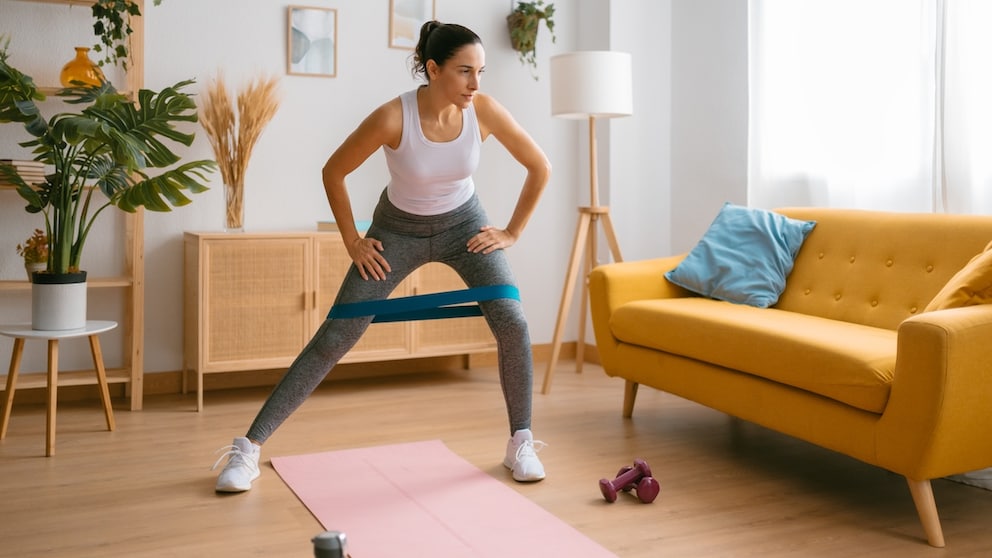 A woman does a workout at home