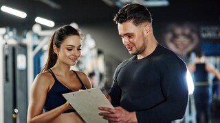 Woman and man exchange ideas in the gym