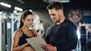 Woman and man exchange ideas in the gym
