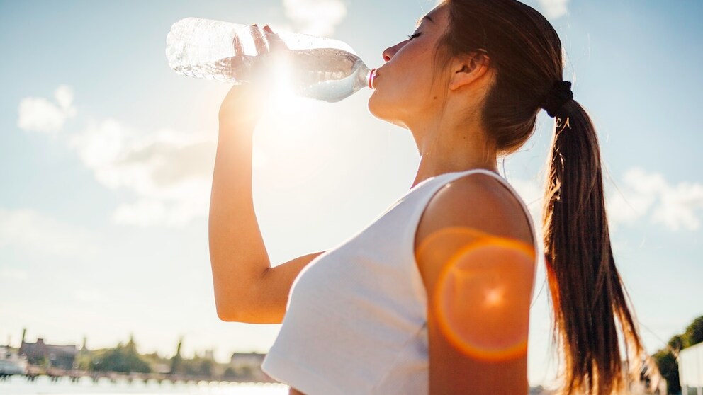 A woman drinks water