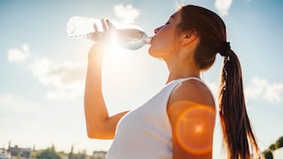 A woman drinks water