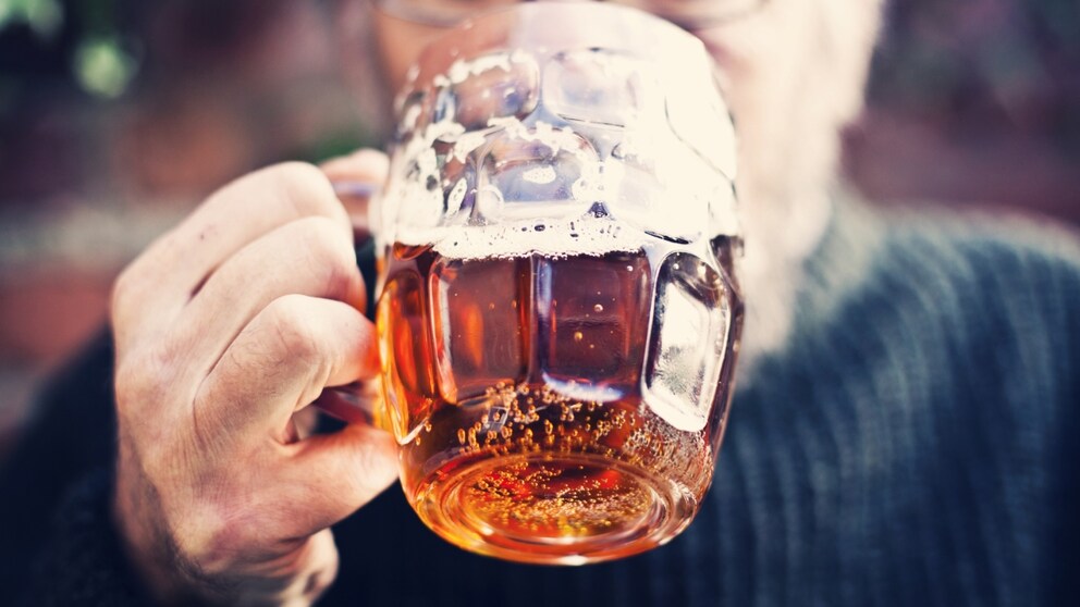 Man drinks alcoholic beverage