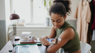 A woman measures her blood sugar level