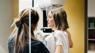 Woman with breast cancer is examined