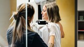 Woman with breast cancer is examined