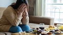 Unhappy woman before her meal: There is a link between a meat-free diet and the likelihood of developing depression