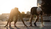 Crunning is a fitness trend that combines running and crawling, offering a unique workout experience. Participants move on all fours, engaging different muscle groups compared to traditional running. This activity is gaining popularity for its intense physical challenge and novelty.