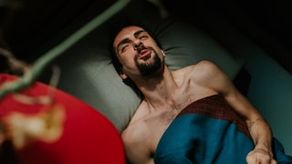 Man Lying in Bed