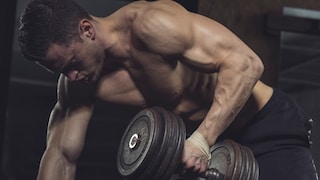Man Trains at the Gym