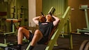 The Hackenschmidt machine, also known as the hack squat, is used to train the legs.