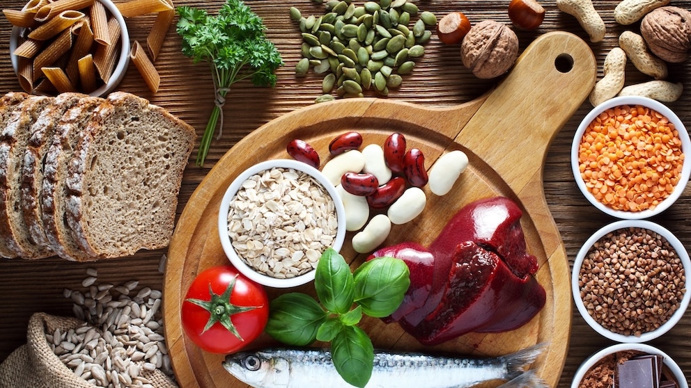 Fish, liver, beans, bread, etc., on a table