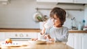 Child Drinks a Glass of Milk