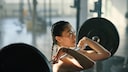 woman lifts weights