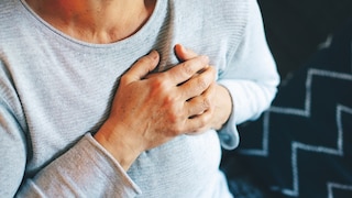 Woman Holds Heart