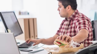 man eats while working