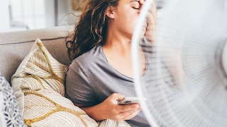 Woman Overheats in Front of Fan