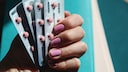 Study Examines Contraceptives in Context of Brain Tumors: Woman Holds Pills