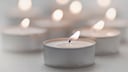 Many candles produce soot–including tealights, for example.