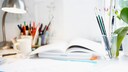You can easily make a DIY wall board for your desk from a wooden board to create more space and organization