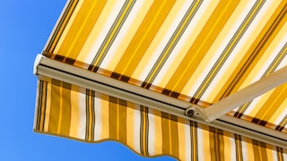 Extended, striped awning