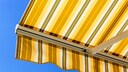 Extended, striped awning