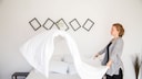 Woman Makes Bed