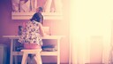 Child Sitting at a White Desk