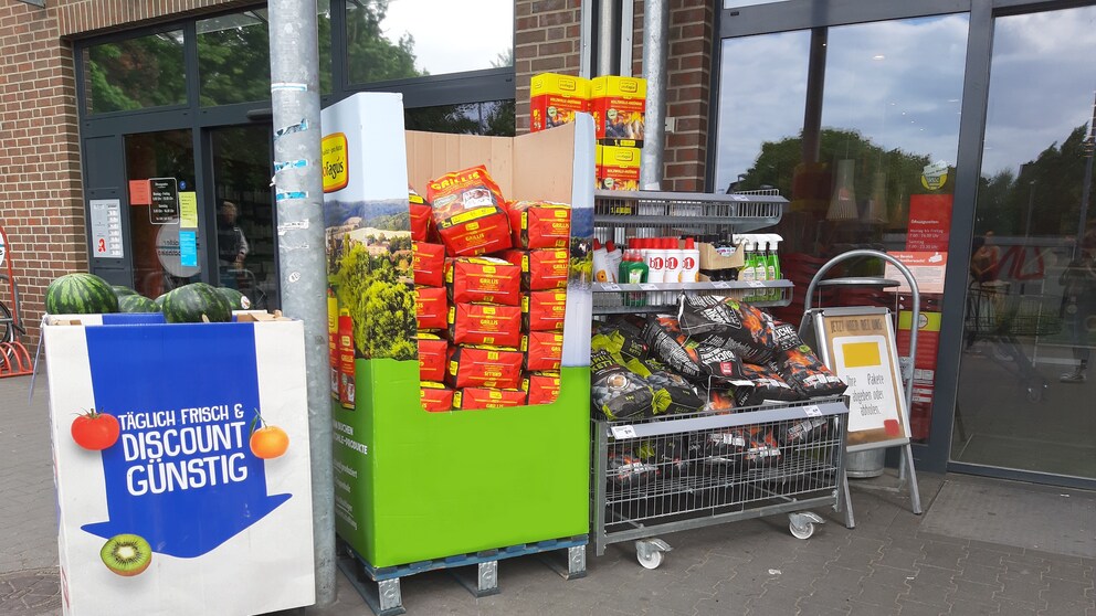 Charcoal in Front of the Supermarket