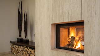 Fireplace with travertine wall paneling